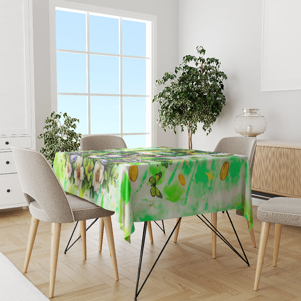 Green tablecloth with floral and butterfly print, on a dining table with chairs