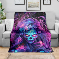 Skull graphic throw blanket with purple-blue fantasy face and swirling flowers