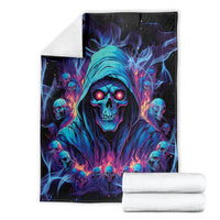 Skull art blanket and folded white towels, blue hooded reaper face design