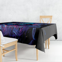 Black tablecloth draped over table with vivid blue and purple abstract skull design