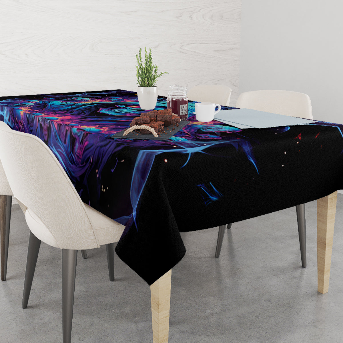 Black tablecloth with blue and purple flame skull pattern, corner drape visible