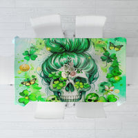 Green tablecloth with Irish skull and shamrock print, rectangular design over chairs.