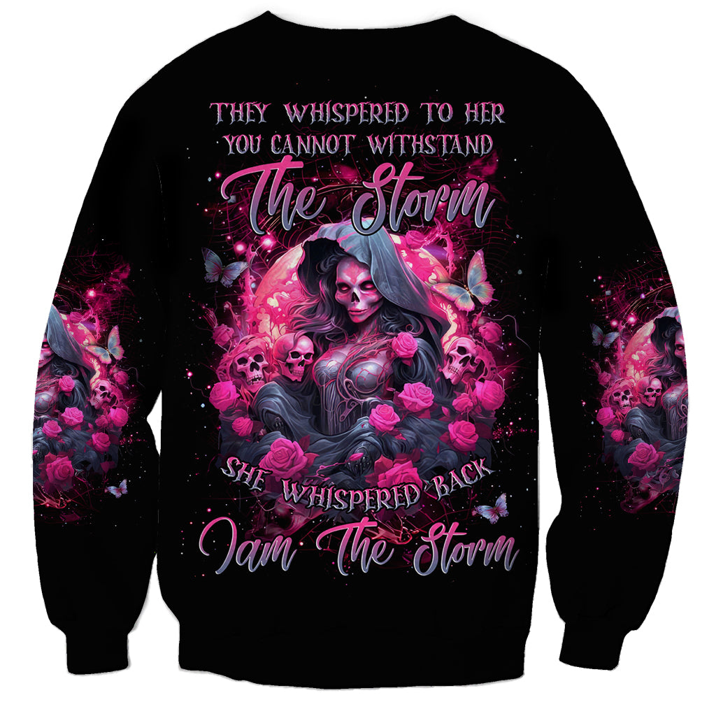 Black unisex sweatshirt with front witch-skull storm graphic and pink roses