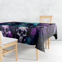 Black gothic skull and rose tablecloth draped over table with purple and blue artwork