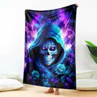 Skull hood blanket with dark background, neon blue face, and purple rose and flame pattern