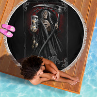 Black round beach blanket with grim reaper skeleton, hourglass and skull design, white fringe border