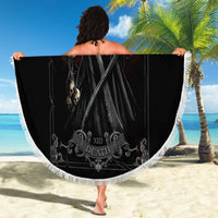 Black round beach blanket with grim reaper skull artwork and white fringed edge