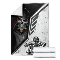 Folded black and white skull and motorcycle rider blanket with diagonal stripe