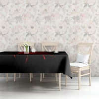 Black tablecloth with red skull graphic and drips, on dining table
