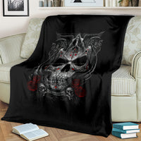 Black skull throw blanket draped over couch, red rose and dagger print