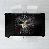 Black tablecloth with gothic skull and cross motif, red accents, draped over a table