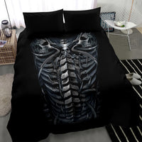 Black duvet cover with large skull-and-skeleton ribcage graphic and two black pillows