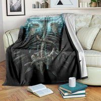 Black skeleton throw blanket featuring teal glowing ribs and twin skull graphic