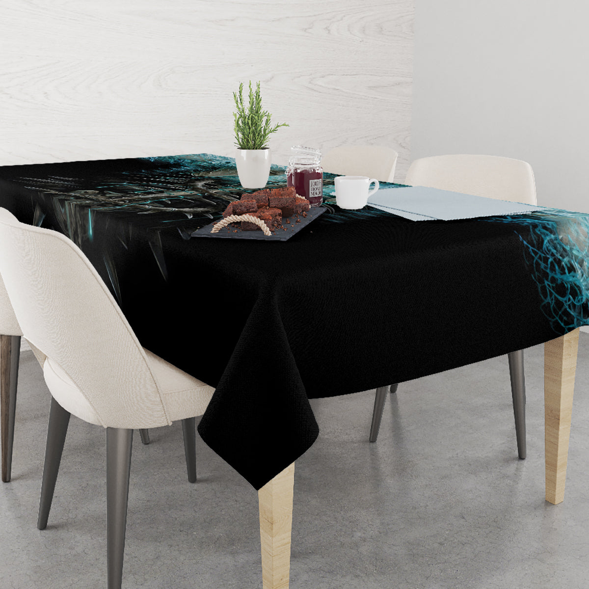 Black tablecloth with blue flame skull pattern, draped over dining table