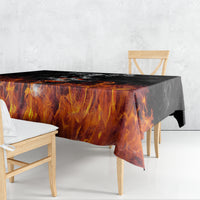 Black tablecloth with orange flame graphic, draped over table with long side drop