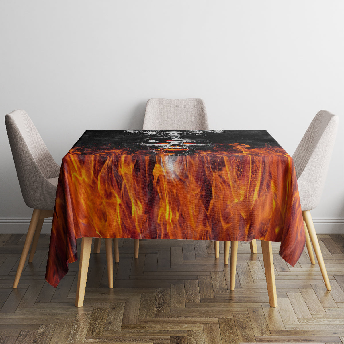 Orange-and-black flame patterned tablecloth on dining table with four chairs