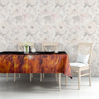 Flame-themed tablecloth on dining table, black base with orange burning pattern