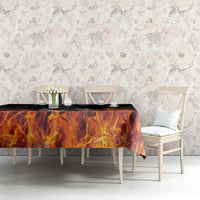 Black flame tablecloth with orange fire pattern on long table