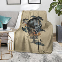 Beige skull graphic throw blanket on gray sofa, with side table and plant