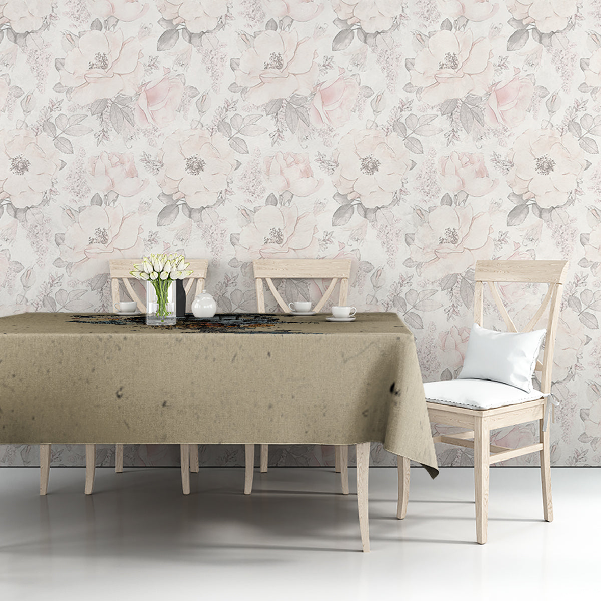 Beige tablecloth on a long table with skull illustration and floral accent details