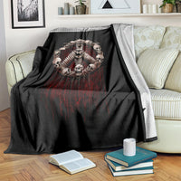 Black throw blanket draped over furniture with skull angel skeleton circular motif