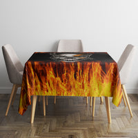Flame-pattern tablecloth with black base, on dining table with chairs