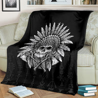 Black skull chief skeleton blanket covering a sofa, bold skull headdress graphic centered