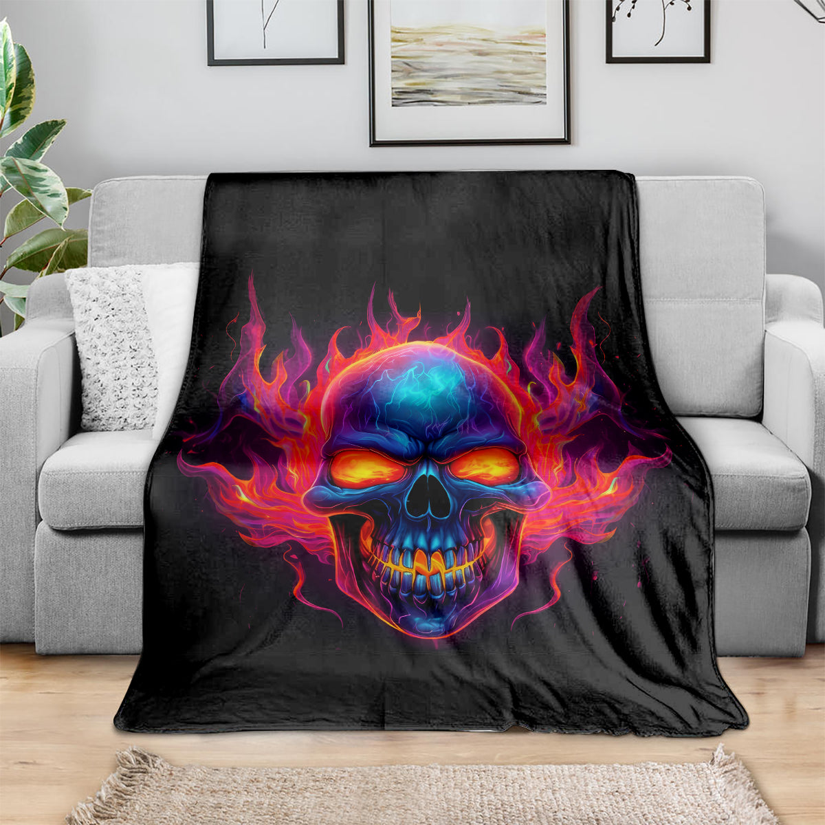 Black skull flame blanket draped over sofa, vivid skull head with burning fire surround