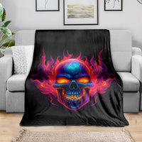 Black skull flame blanket draped over sofa, vivid skull head with burning fire surround