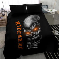 Black bedding set with skull illustration, orange vertical text, and two black pillow shams