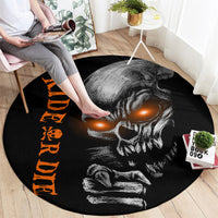 Black round carpet with skull face, glowing orange eyes, and orange letter column