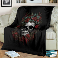 Black skull blanket with red roses, blanket covering the back of a sofa