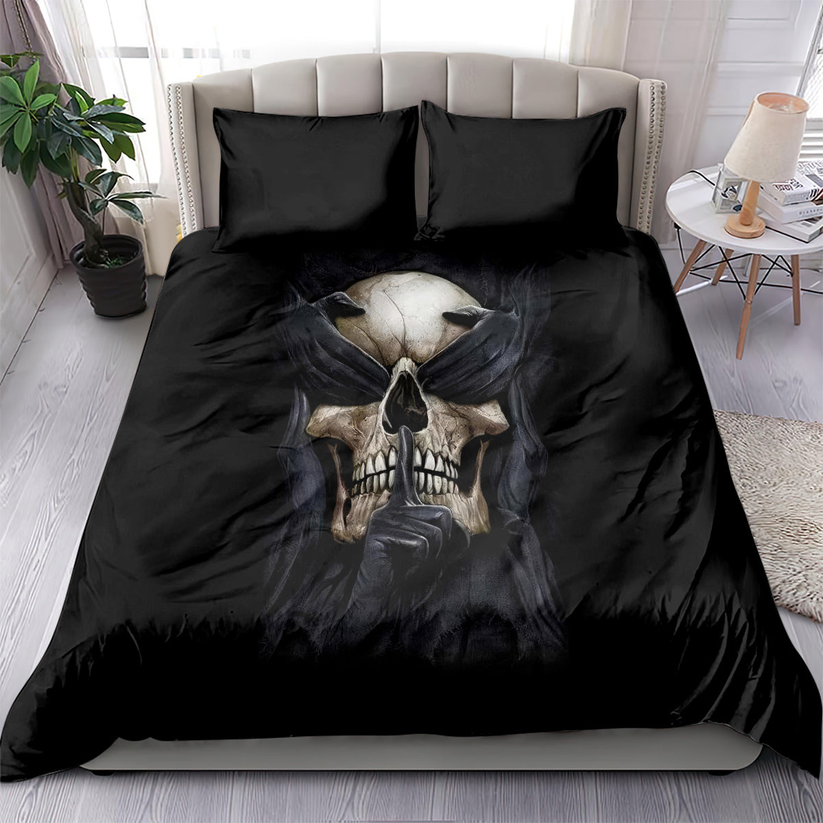 Black skull bedding set with hands-draped design on comforter and two matching pillows
