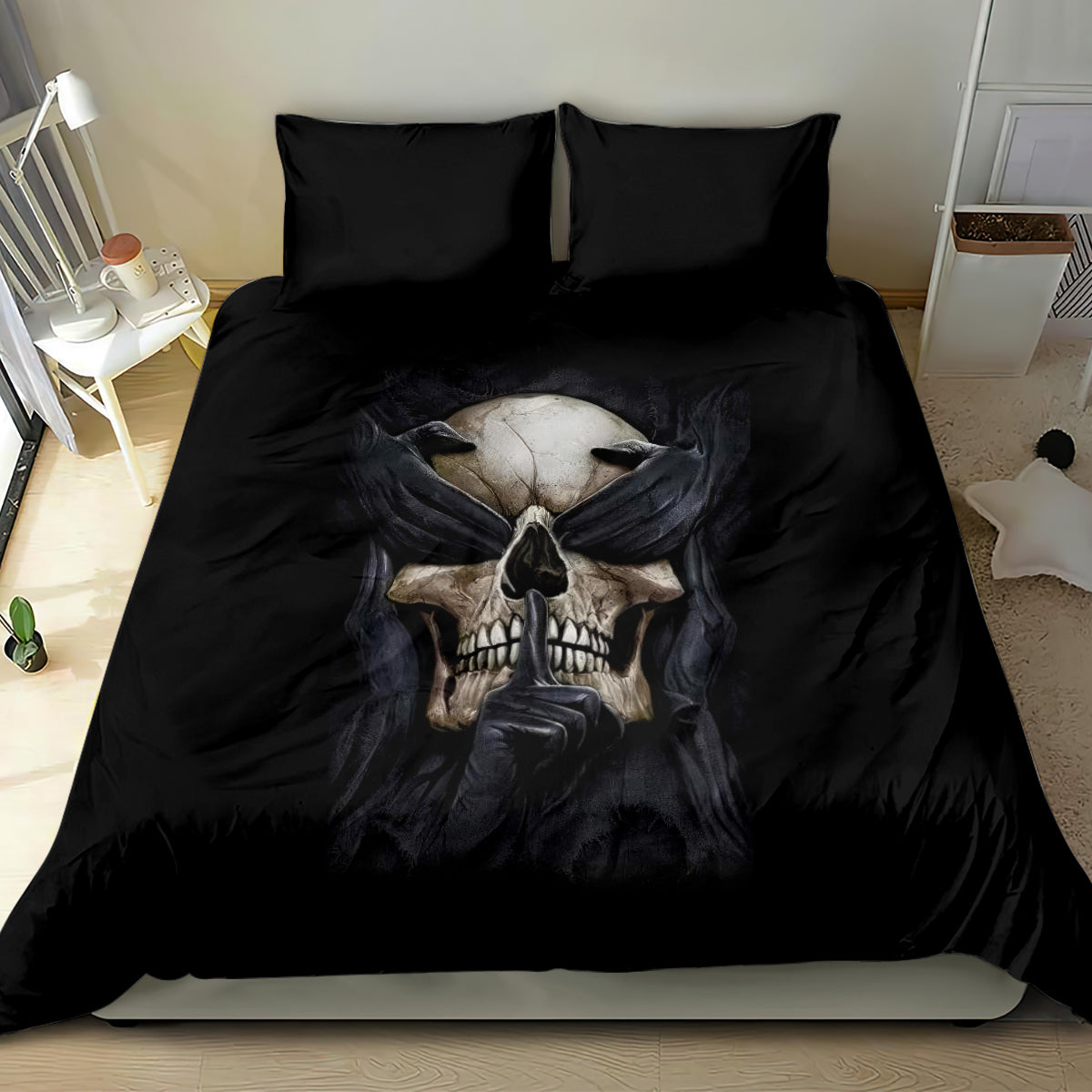Black skull bedding set with central skull face and folded hands graphic on comforter