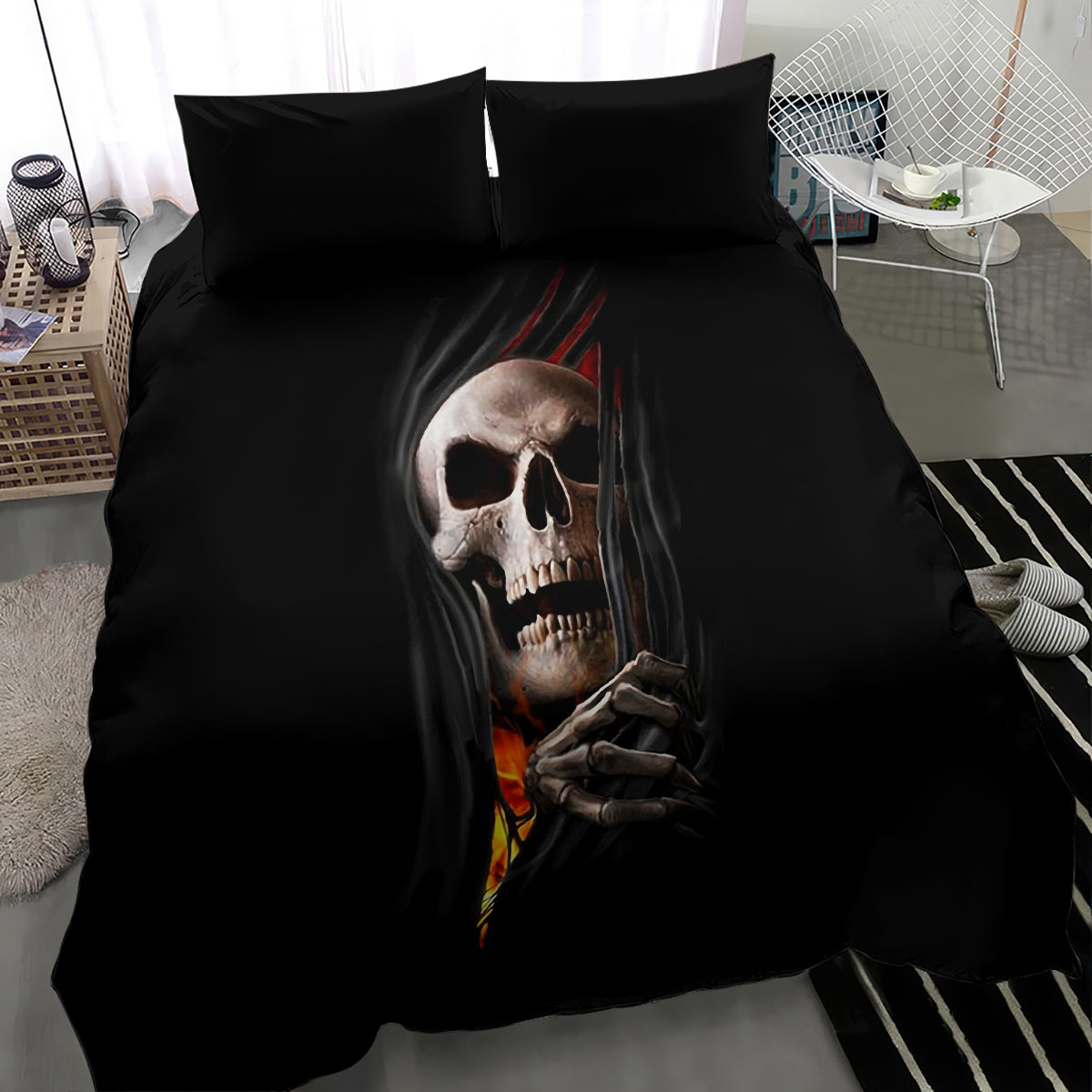 Black duvet set with central skull-and-hands illustration and glowing flame accents