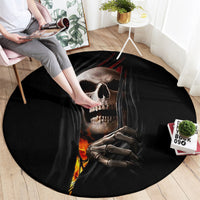 Round black area rug featuring skull in gray cloak with flames and ribcage