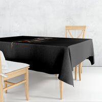 Black tablecloth draped on table with skull-and-flame graphic center
