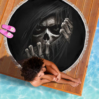 Black round beach blanket with white fringe and skull skeleton hand graphic