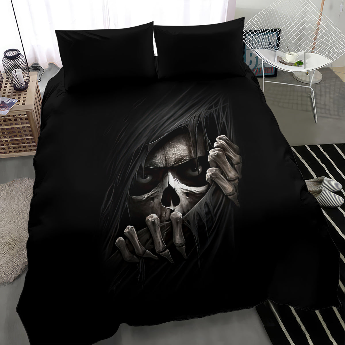 Black bedding set with skull face and skeletal hands print on duvet, two pillows