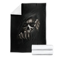 Black skull and skeleton graphic blanket, folded flat with artwork centered