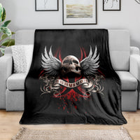 Black skull wing graphic throw blanket with red accents, spread on sofa