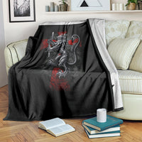 Black blanket with large crusader skull graphic, red accents, draped over armchair