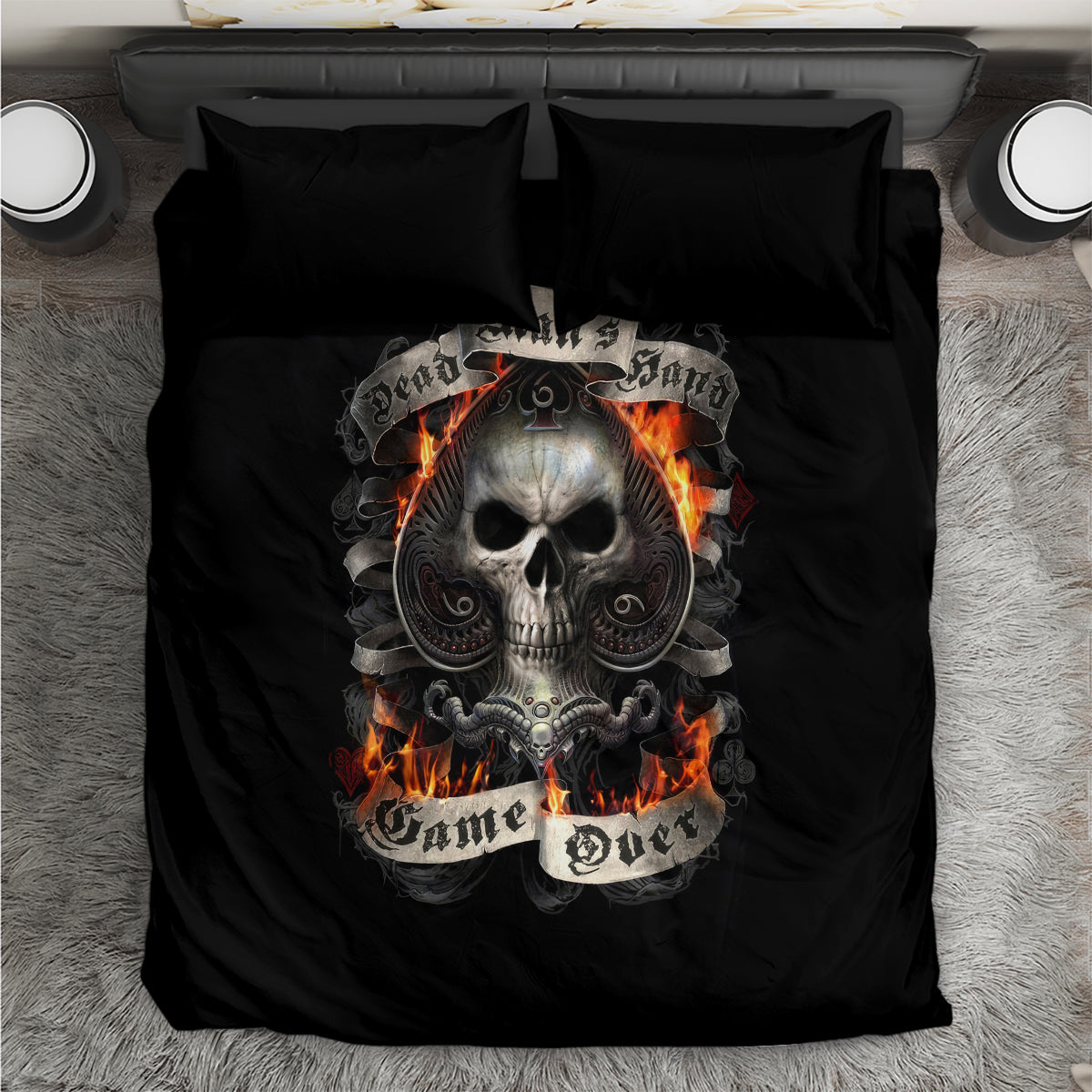 Black bedding set with skull graphic and flames on duvet, matching black pillows