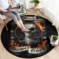 Black round rug featuring a skull center with orange flames and ornate swirls