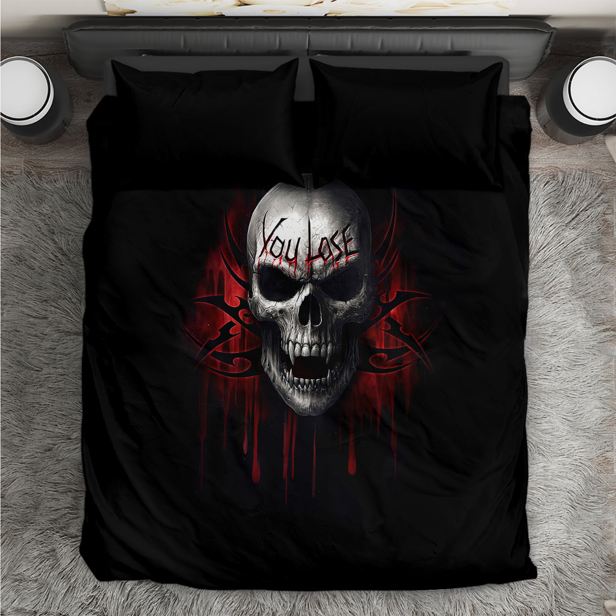 Black bedding set with centered gray skull face and red dripping design, flat sheet front