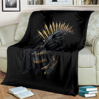 Black skull gang blanket over cream sofa, golden spiked crown skull design