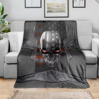Black skull themed throw blanket draped over sofa, metal head with stars and stripes