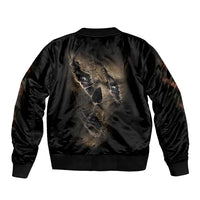 Black bomber jacket with ribbed hem and large gold mummy face graphic on back