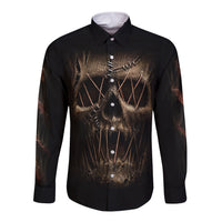 Black long-sleeve button shirt with front mummy-face skull graphic