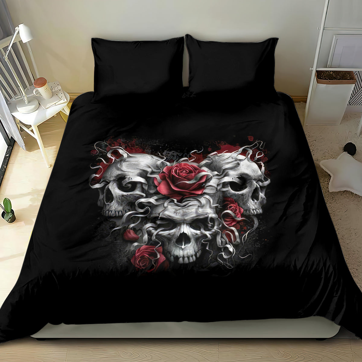 Black bedding set with three skull and red rose graphic centered on duvet, matching black pillows
